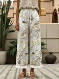 Women's White Bee and Flower Print Drawstring Waist Cropped Pants with Rolled Cuffs and Pockets for Casual Everyday Wear